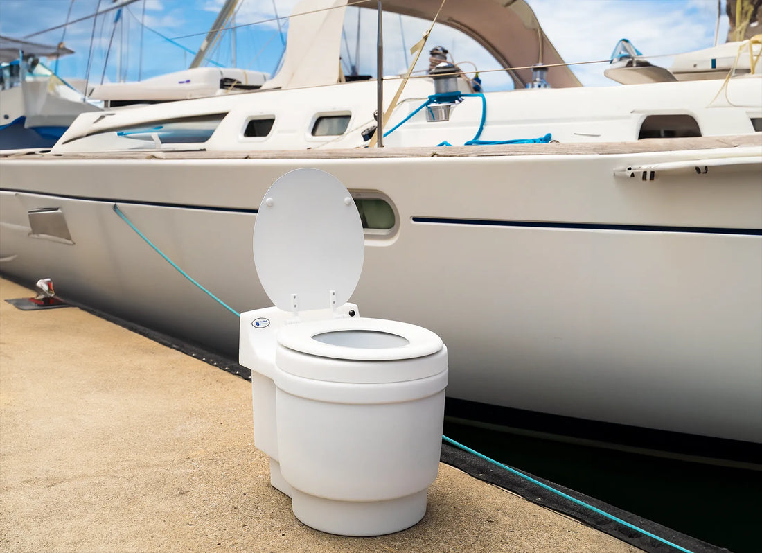 Laveo DryFlush portable toilet on a jetty beside a boat