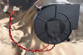 DryFlush inlet fan with twisted red and black wires and two terminal connectors