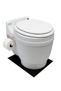 White Laveo DryFlush toilet with a side toilet roll holder standing on a black silicone mat