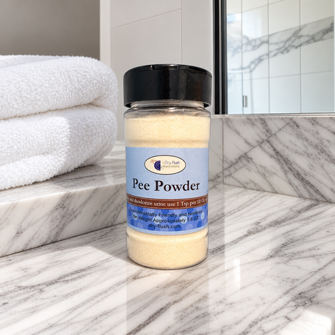 Single bottle of DryFlush Pee Powder on a marble bathroom vanity