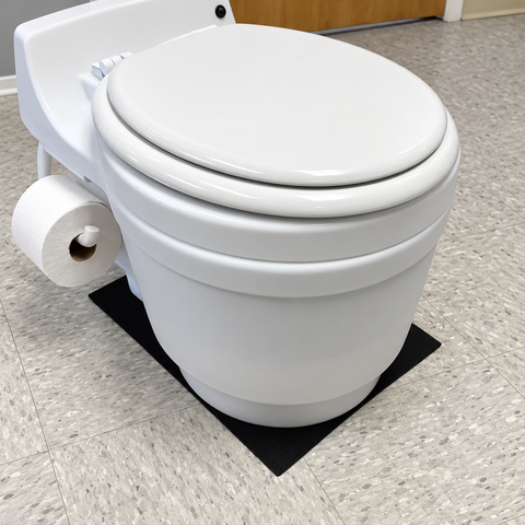 Laveo DryFlush toilet standing on the black non-slip silicone mat