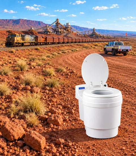 Illustrative mining-site concept showing a white Laveo DryFlush toilet